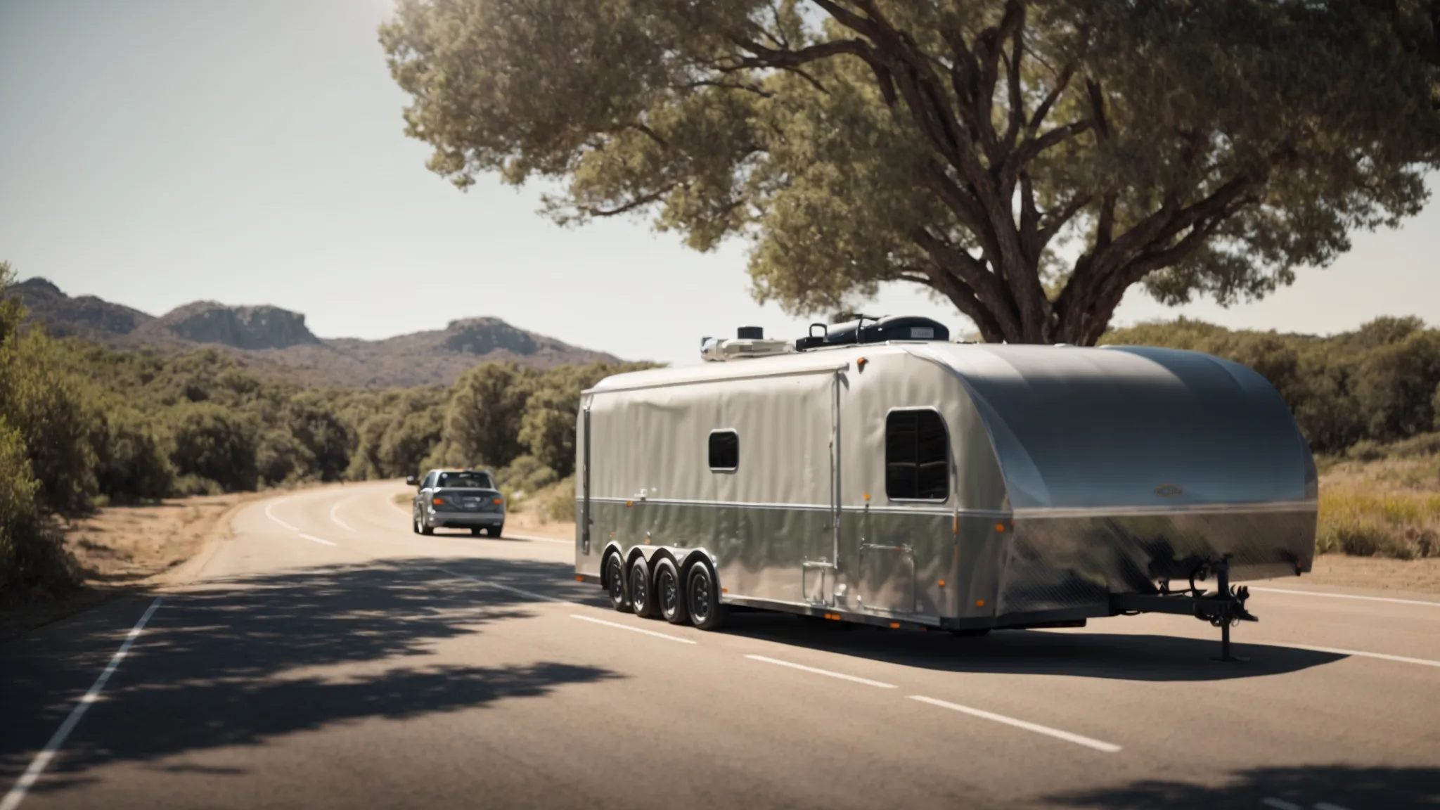 a vehicle towing a trailer on a clear, open road during daylight, showcasing the stability provided by a properly installed weight distribution system.